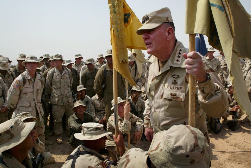 U.S. Army Chief of Staff John Keane listens as soldiers from 1st Battalion 64 Armor Regiment ask him questions during his visit to Fallujah, Iraq Saturday, July 5, 2003. The four-star general is on a three-day visit to see American soldiers in Iraq. One soldier asked him about a proposal to reduce the size of the Army, and he replied, " We have our hands full. We will not reduce the Army. " (AP Photo/John Moore)