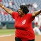 **FILE** Kaya Henderson, chancellor of Washington public schools, reacts after throwing out a ceremonial first pitch, before a baseball game between the Washington Nationals and the Philadelphia Phillies at Nationals Park Wednesday, June 4, 2014, in Washington. (AP Photo/Alex Brandon)

