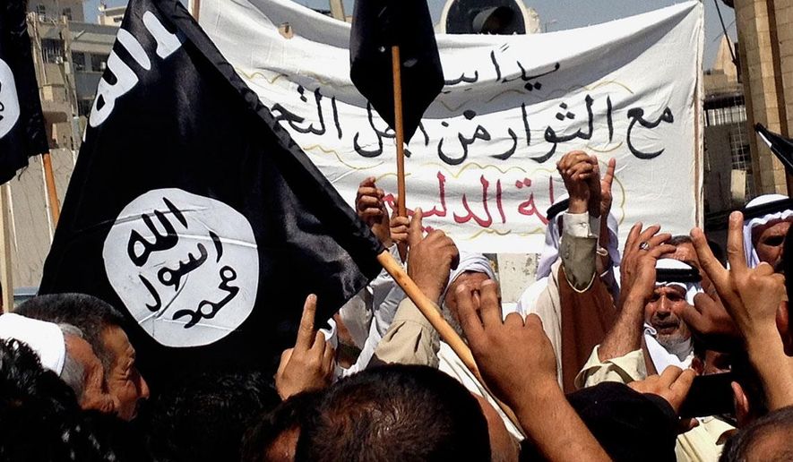 Demonstrators chant pro-al-Qaida-inspired Islamic State of Iraq and the Levant (ISIL) as they wave al-Qaida flags in front of the provincial government headquarters in Mosul, 225 miles (360 kilometers) northwest of Baghdad, Iraq, Monday, June 16, 2014. Sunni militants captured a key northern Iraqi town along the highway to Syria early on Monday, compounding the woes of Iraq&#x27;s Shiite-led government a week after it lost a vast swath of territory to the insurgents in the country&#x27;s north. (AP Photo)