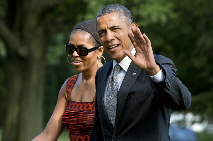 ** FILE ** President Barack Obama waves as he walks with first lady Michelle Obama on their return to the White House from a trip to California, Monday, June 16, 2014, in Washington. (AP Photo/Jacquelyn Martin)