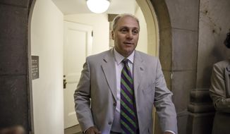FILE - This June 11, 2014, file photo shows Rep. Steve Scalise, R-La., walking through a staircase at the Capitol in Washington. The contest for the No. 3 spot in the House GOP has turned into tea party conservatives’ last, best shot at congressional leadership after getting shut out of the top two jobs in the shakeup following Majority Leader Eric Cantor’s surprise primary defeat. All three _ Scalise of Louisiana, Peter Roskam of Illinois, and Marlin Stutzman _ are to make their case to GOP rank-and-file lawmakers Wednesday ahead of votes on Thursday. (AP Photo/J. Scott Applewhite)