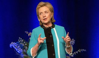 Former U.S. Secretary of State Hillary Rodham Clinton delivers a keynote address during a luncheon in Edmonton, Alberta on Wednesday June 18, 2014. (AP Photo/The Canadian Press, Jason Franson)