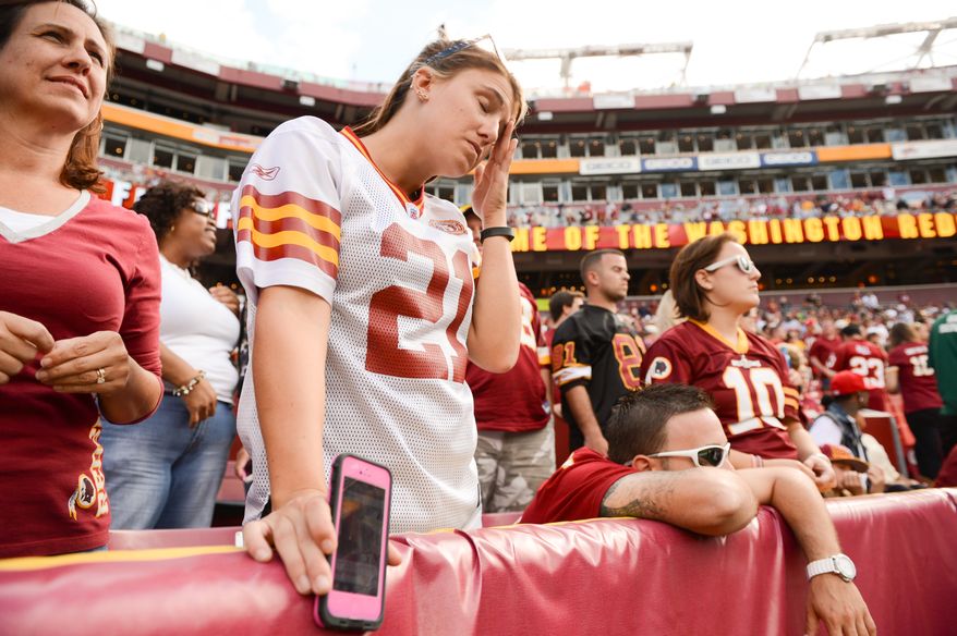 Kayla Fitzgerald of Annapolis, Md. shows her frustration as in the closing minutes of the game as the Washington Redskins lose to the Detroit Lions 27-20 in NFL football at FedExField, Landover, Md., Monday, September 9, 2013. (Andrew Harnik/The Washington Times)