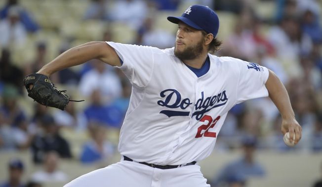 Los Angeles Dodgers starting pitcher Clayton Kershaw throws against the Colorado Rockies during first inning of a baseball game in Los Angeles, Wednesday, June 18, 2014. (AP Photo/Chris Carlson)