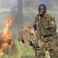 **FILE** One of the 1,800 Uganda Peoples Defence Force (UPDF) soldiers being sent to the African Union peacekeeping mission in Somalia participates in a Dec. 21 drill at Singo Military training camp, about 100 kilometers north of Kampala. (Associated Press)