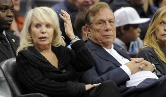 FILE - In this Nov. 12, 2010, file photo, Shelly Sterling sits with her husband, Donald Sterling, right, during the Los Angeles Clippers&#x27; NBA basketball game against the Detroit Pistons in Los Angeles. Shelly Sterling&#x27;s attorneys have asked a court on Thursday June 19, 2014, to hold a hearing on allegations that Donald Sterling and his attorneys have threatened her legal team and the doctors who assert that the Los Angeles Clippers co-owner is mentally incapacitated.(AP Photo/Mark J. Terrill, File)