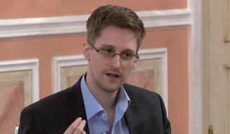 In this image made from video released by WikiLeaks on Friday, Oct. 11, 2013, former National Security Agency systems analyst Edward Snowden speaks during a presentation ceremony for the Sam Adams Award in Moscow, Russia. (AP Photo) ** FILE **