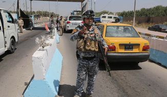 Iraqi federal policemen stand guard at a checkpoint in Baghdad, Iraq. Tensions in the country have heated up as the extremist ISIL group has allied with more moderate, secular Sunni militant groups, many of whom are not even targets of U.S. operations. (associated press)
