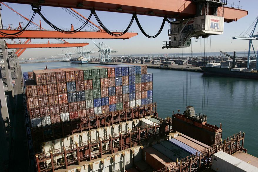 **FILE** Cargo is unloaded from the APL Singapore vessel at the port of Los Angeles on Dec. 4, 2006. (Associated Press)