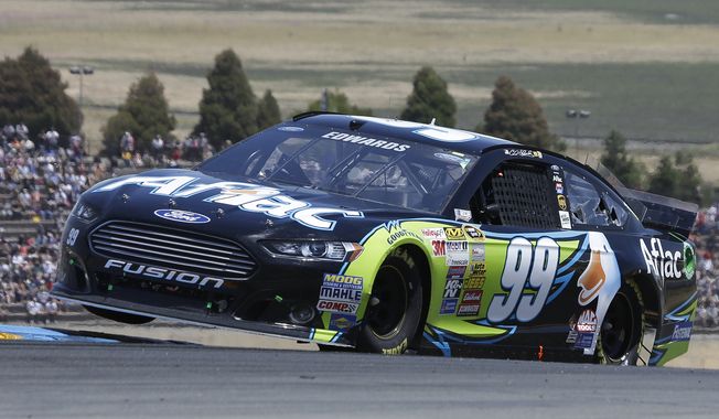 Carl Edwards competes during the NASCAR Sprint Cup Series auto race on Sunday, June 22, 2014, in Sonoma, Calif. (AP Photo/Eric Risberg)