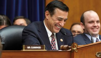 Rep. Darrell E. Issa, California Republican and the chairman of the House Oversight and Government Reform Committee, has a rare light moment as his panel questions Internal Revenue Service Commissioner John Koskinen in the probe of whether tea party groups were improperly targeted for scrutiny. (Associated Press)
