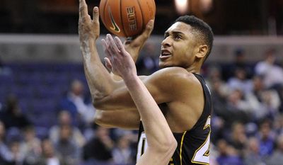 Towson forward Jerrelle Benimon, right, is fouled by Georgetown forward Nate Lubick (34) during the first half of an NCAA college basketball game, Saturday, Dec. 8, 2012, in Washington. (AP Photo/Nick Wass)