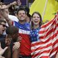 Fans celebrate as the United States scores a goal against Portugal while watching a World Cup soccer match, Sunday, June 22, 2014, in Orlando, Fla. (AP Photo/John Raoux)