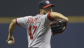 Washington Nationals starting pitcher Gio Gonzalez throws to the Milwaukee Brewers during the first inning of a baseball game Monday, June 23, 2014, in Milwaukee. (AP Photo/Jeffrey Phelps) 