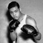 This Jan. 24, 1937 file photo shows boxer Joe Louis, nicknamed the Brown Bomber, posing in Pompton Lakes, N.J. Louis captures the world heavyweight title in June 1937 and held it until May 1949.   (AP Photo/File)  **FILE**