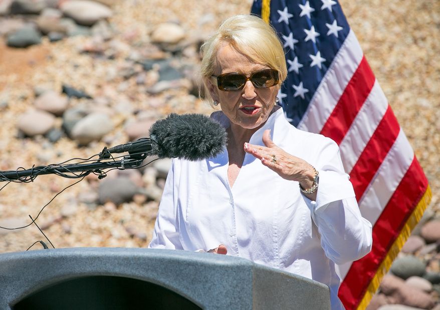 Arizona Gov. Jan Brewer speaks at the U.S. Customs and Border Protection facilities in Nogales, Ariz., on June 25, 2014, about some of the unaccompanied children that crossed the border. (Associated Press/The Arizona Republic)