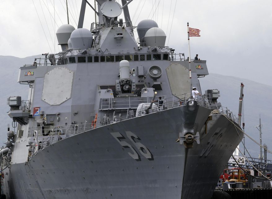 The U.S. Navy warship USS John McCain, an Arleigh-Burke class destroyer, is docked at the Subic Freeport to take part in the joint US-Philippines naval exercise called Cooperation Afloat Readiness And Training (CARAT) at the former US naval base of Subic, about 70 miles west of Manila, Philippines Thursday, June 26, 2014. After more than a decade of helping fight al-Qaida-linked militants, the United States is disbanding an anti-terror contingent of hundreds of elite American troops in the southern Philippines where armed groups such as the Abu Sayyaf have largely been crippled, officials said Thursday. The move reflects shifting security strategies and focus in economically vibrant Asia, where new concerns such as multiple territorial conflicts involving China have alarmed Washington's allies entangled in the disputes. (AP Photo/Bullit Marquez)
