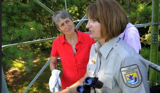 U.S. Interior Secretary Sally Jewell, left, listens to U.S. Fish and Wildlife Service refuge manager Kimberly Hayes, right, while in a look-out tower during a tour of the Harris Neck National Wildlife Refuge in Townsend, Ga., Thursday, June 26, 2014. Jewell announced Thursday that the federal government is upgrading the wood stork to a &amp;quot;threatened&amp;quot; species, a step up from endangered that indicates the birds are no longer considered at risk of extinction. (AP Photo/Stephen B. Morton)