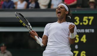 Rafael Nadal of Spain celebrates as he defeated Lukas Rosol of Czech Republic  in their men&#39;s singles match on Centre Court at the All England Lawn Tennis Championships in Wimbledon, London, Thursday, June 26, 2014. (AP Photo/Pavel Golovkin)