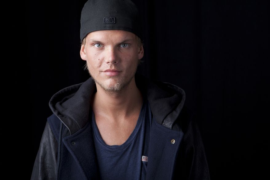 FILE - In this Aug. 30, 2013 file photo, Swedish DJ, remixer and record producer Avicii poses for a portrait, in New York. Many people who attended an electronic dance music show featuring Swedish disc jockey Avicii at the TD Garden arena on Wednesday June 25, 2014 showed up intoxicated and several were hospitalized, authorities said. The Emergency Medical Service took 22 people to the hospital, and a dozen more were under evaluation, EMS Deputy Superintendent Mike Bosse told the Boston Herald. (Photo by Amy Sussman/Invision/AP, file)