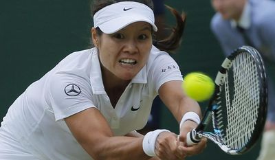 Li Na of China plays a return to Barbora Zahlavova Strycova of the Czech Republic during their women&#39;s singles match at the All England Lawn Tennis Championships in Wimbledon, London, Friday  June  27, 2014. (AP Photo/Pavel Golovkin)