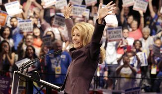 Gubernatorial hopeful and state Sen. Wendy Davis waves before speaking at the Dallas Convention Center during the Texas Democratic Convention in Dallas, Friday, June 27, 2014. (AP Photo/LM Otero)