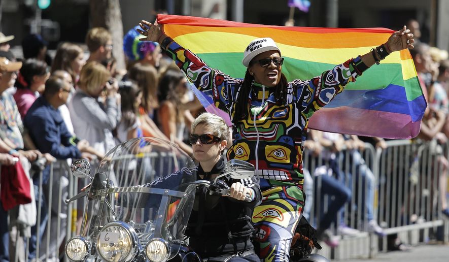 Members of the Dykes on Bikes motorcycle group lead off the 44th annual San Francisco Gay Pride parade Sunday, June 29, 2014, in San Francisco. The lesbian, gay, bisexual, and transgender celebration and parade is one of the largest LGBT gatherings in the nation. (AP Photo/Eric Risberg)  ** FILE **