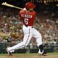 Washington Nationals&#39; Anthony Rendon follows through on his RBI double during the seventh inning of a baseball game against the Atlanta Braves at Nationals Park on Saturday, June 21, 2014, in Washington. The Nationals won 3-0. (AP Photo/Alex Brandon)