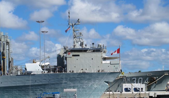 A Canadian ship sits docked at Pearl Harbor, Hawaii, during the the Rim of the Pacific naval exercises on Monday, June 30, 2014. (AP Photo/Audrey McAvoy)