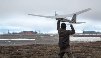 In this photo June 7, 2014, photo released by BP Alaska, Unmanned Aerial System (UAS) technology using an AeroVironment Puma drone is given a pre-flight checkout in preparation for flights by BP at its Prudhoe Bay, Alaska operations. The Federal Aviation Administration granted the first permission for commercial drone flights over land, the latest effort by the agency to show it is loosening restrictions on commercial uses of the unmanned aircraft.  The federal effort to provide drones regular access to U.S. skies faces significant hurdles and won&#39;t meet a September 2015 deadline set by Congress, said a report released June 30 by a government watchdog. A report by the Transportation Department&#39;s inspector general says the Federal Aviation Administration hasn&#39;t figured out what kind of technology unmanned aircraft should use to avoid crashing into other planes. (AP Photo/BP Alaska)