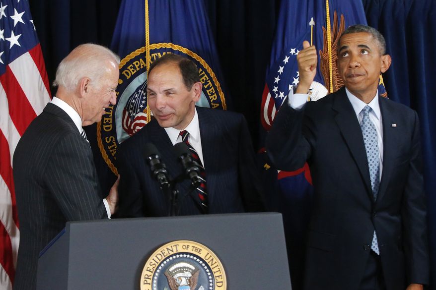 President Barack Obama givers a thumbs up to audience members seated above as he nominates former Procter and Gamble executive Robert McDonald, center, as the next Veterans Affairs secretary at the Department of Veterans Affairs in Washington, Monday, June 30, 2014. Vice President Joe Biden is at left. If confirmed by the Senate, McDonald would succeed Eric Shinseki, the retired four-star general who resigned last month as the scope of the issues at veterans' hospitals became apparent. (AP Photo/Charles Dharapak)
