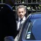 Former French President Nicolas Sarkozy leaves his house in Paris, Wednesday, July 2, 2014. Sarkozy, his lawyer and a magistrate are facing preliminary charges in a corruption investigation linked to allegations that he took 50 million euros ($67 million) in illegal campaign funds from Libya&#39;s Moammar Gadhafi, after a night of questioning by judicial officials. (AP Photo/Jacques Brinon)
