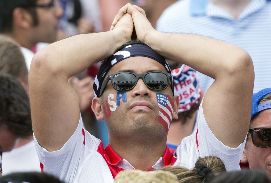 A U.S. soccer fan shows his disappointment at a World Cup soccer viewing party in Redondo Beach, Calif., after a they lost 2-1 to Belgium Tuesday, July 1, 2014. (AP Photo/The Orange County Register, Kyusung Gong)