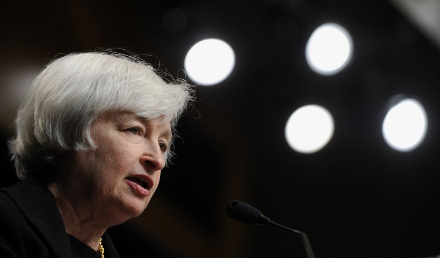 Federal Reserve Chair Janet Yellen speaks at the International Monetary Fund in Washington, Wednesday, July 2, 2014. Yellen said she doesn't see a need for the Fed to start raising interest rates to address the risk that extremely low rates could destabilize the financial system. (AP Photo/Susan Walsh)