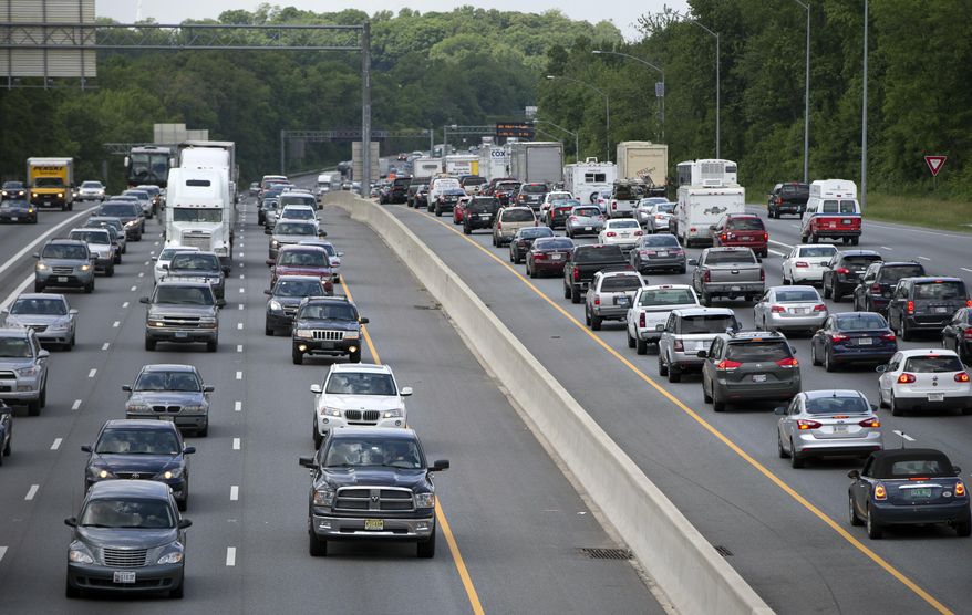 FILE - In this May 23, 2014 file photo, traffic moves on the Interstate 495, the Capital Beltway, in Hyattsville, Md., outside Washington. The Centers for Disease Control and Prevention released its latest drowsy driving report on Thursday, July 3, 2014. According to a new survey, about 1 in 25 adults say they recently fell asleep while driving. (AP Photo/Carolyn Kaster, File)
