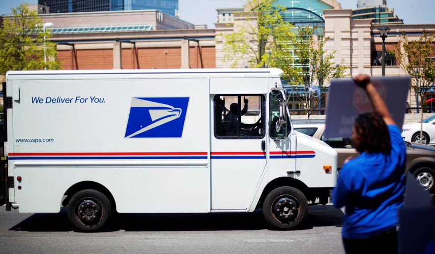 Postal workers may be famous for delivering that check in the mail. But they apparently are also good at grabbing cash advances off their official credit cards to satisfy their personal hunger. 
 (AP Photo/David Goldman)