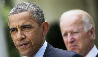 **FILE** President Obama, accompanied by Vice President Joe Biden, makes a statement about immigration reform on June 30, 2014, in the Rose Garden of the White House in Washington. (Associated Press)