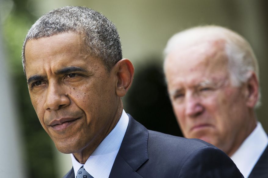 **FILE** President Obama, accompanied by Vice President Joe Biden, makes a statement about immigration reform on June 30, 2014, in the Rose Garden of the White House in Washington. (Associated Press)