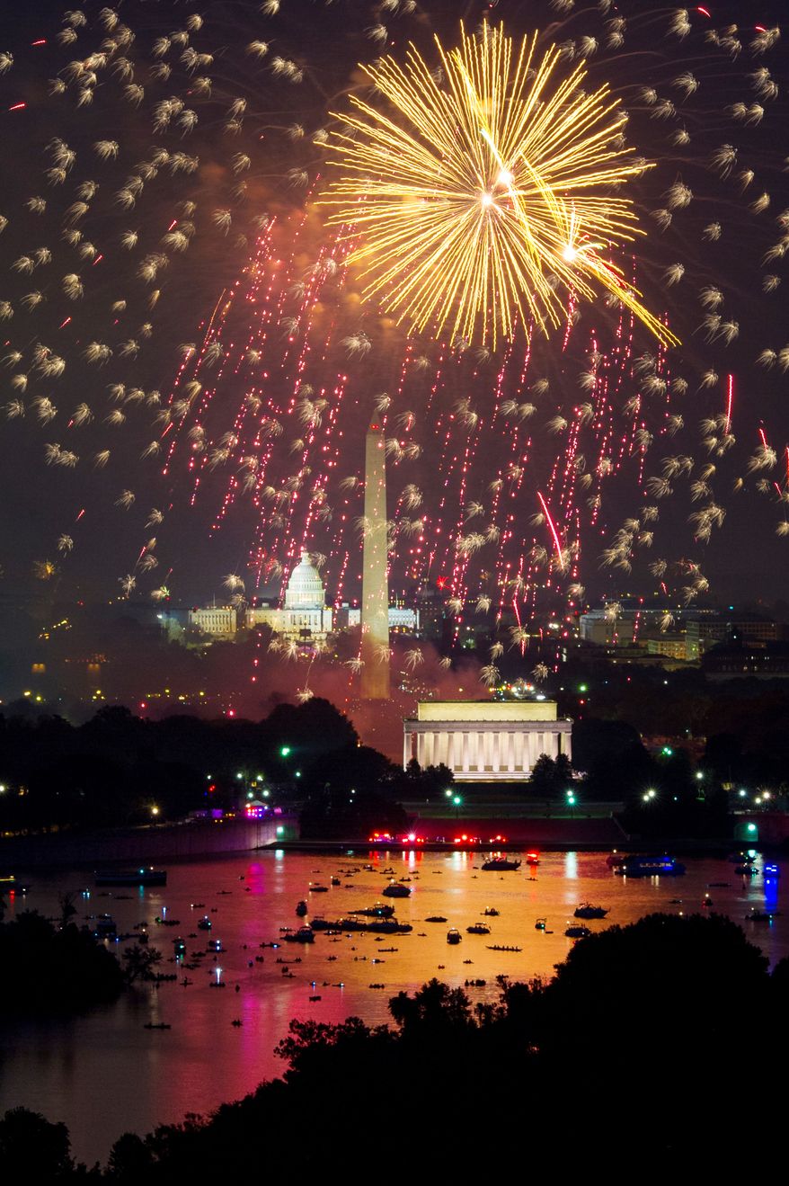 Washington D.C. fireworks can be seen from the Top of the Town as they explode over the National Mall to celebrate Independence Day. (Andrew Harnik/The Washington Times)