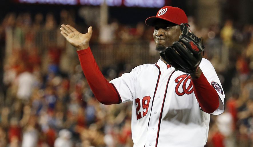 Washington Nationals relief pitcher Rafael Soriano celebrates after the last out of a baseball game against the Colorado Rockies at Nationals Park, Wednesday, July 2, 2014, in Washington. The Nationals won 4-3, and swept the three-game series with the Rockies. (AP Photo/Alex Brandon)