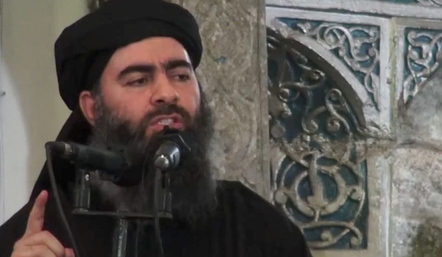 ** FILE ** Abu Bakr al-Baghdadi, the shadowy leader of the Islamic State, delivers a sermon posted on social media outlets that the militants use. (Associated Press)