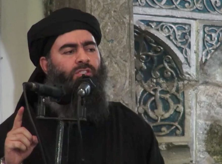 ** FILE ** Abu Bakr al-Baghdadi, the shadowy leader of the Islamic State, delivers a sermon posted on social media outlets that the militants use. (Associated Press)