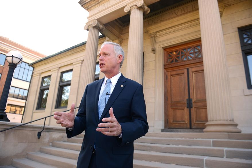 U.S. Sen. Ron Johnson holds a news conference on the steps of Wisconsin Eastern District Federal Courthouse Monday, July 7, 2014 in Green Bay, Wis. (AP Photo/The Green Bay Press-Gazette, Jim Matthews) ** FILE **