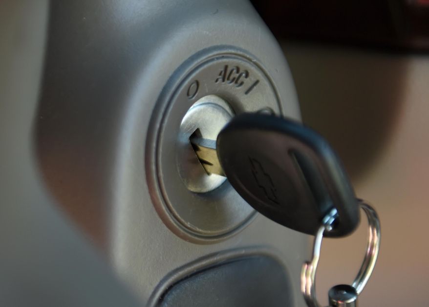 FILE - This Tuesday, April 1, 2014 file photo shows a key in the ignition switch of a 2005 Chevrolet Cobalt in Alexandria, Va. Responding to complaints about "cheap-feeling" switches that required too much effort to turn, General Motors set about making new ones that would work more smoothly and give drivers the impression that they were better designed, a GM switch engineer testified in a lawsuit deposition in the spring of 2013. The switches, though, were too loose, touching off events that led to at least 13 deaths, more than 50 crashes and a raft of legal trouble for the Detroit automaker. (AP Photo/Molly Riley, File)
