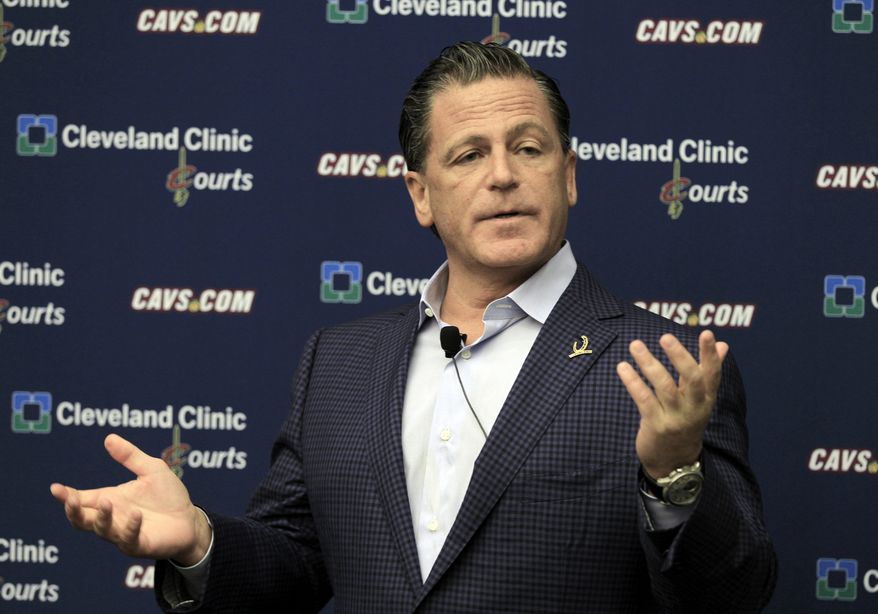 FILE - In this May 9, 2012 file photo, Cleveland Cavaliers owner Dan Gilbert answers questions during a news conference at the team's training facility in Independence, Ohio. As Cavaliers fans breathlessly await a homecoming they never thought possible, the broken relationship between LeBron James and Dan Gilbert could get in the way. (AP Photo/Tony Dejak)