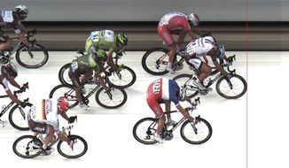 In this photo finish image released by ASO Marcel Kittel of Germany, front, crosses the finish line ahead of second place Norway&#39;s Alexander Kristoff, top, and third place France&#39;s Arnaud Demare, bottom, to win the fourth stage of the Tour de France cycling race over 163.5 kilometers (101.6 miles) with start in Le Touquet and finish in Lille, France, Tuesday, July 8, 2014. (AP Photo/ASO, HO)