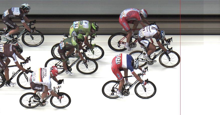 In this photo finish image released by ASO Marcel Kittel of Germany, front, crosses the finish line ahead of second place Norway's Alexander Kristoff, top, and third place France's Arnaud Demare, bottom, to win the fourth stage of the Tour de France cycling race over 163.5 kilometers (101.6 miles) with start in Le Touquet and finish in Lille, France, Tuesday, July 8, 2014. (AP Photo/ASO, HO)