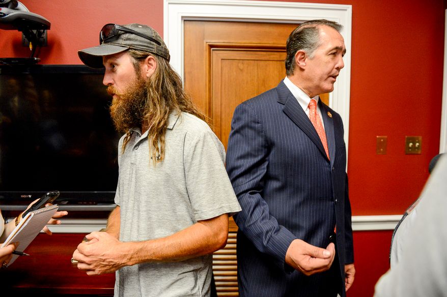 Jase Robertson, right, of the television show Duck Dynasty and Rep. Trent Franks (R-Ariz.), right, speak to reporters at Rep. Frank's Capitol Hill Office, Washington, D.C., Tuesday, July 8, 2014. Robertson was on the hill with her daughter Mia to visit with Rep. Frank. Both Rep. Frank and Mia have had cleft palate surgery, and the Robertson family has started the Mia Moo Fund, a non-profit organization that is dedicated to raising awareness and funds towards research, treatments and causes of cleft lip & palate. (Andrew Harnik/The Washington Times)