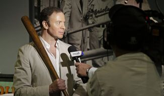 Goldin Auctions President Ken Goldin holds a baseball bat that Babe Ruth used early in his career, Wednesday, July 9, 2014, in Baltimore, as he is interviewed during a media preview of sports memorabilia slated for auction to mark the 100th anniversary of Ruth&#39;s major league debut. (AP Photo/Patrick Semansky) ** FILE **