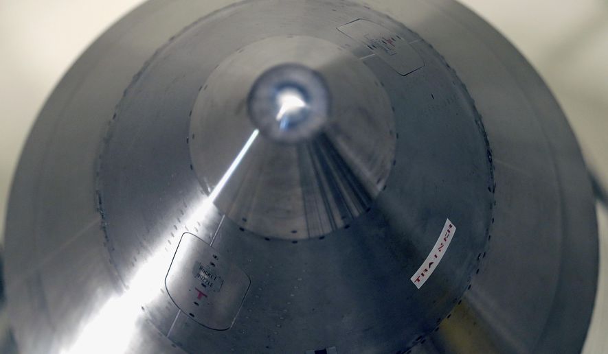 In this photo taken June 25, 2014, the warhead-containing nose cone of an inert Minuteman 3 missile is seen in a training launch tube at Minot Air Force Base, N.D. The base is tasked with maintaining 150 of the nuclear-tipped missiles spread out across the North Dakota countryside and keeping them ready to launch at a moment&#39;s notice as part of the U.S.&#39;s nuclear defense strategy. (AP Photo/Charlie Riedel)
